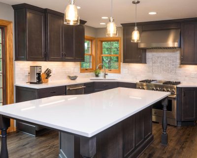 black cabinets with white countertops in kitchen makeover.